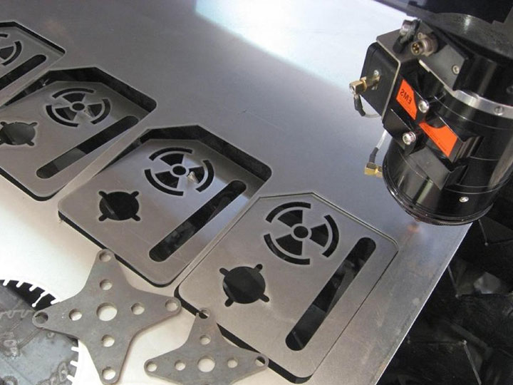 What are the main components of a laser cutting machine?